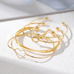 4-Piece Creative Heart Crossed Alloy Bangle Bracelet Set