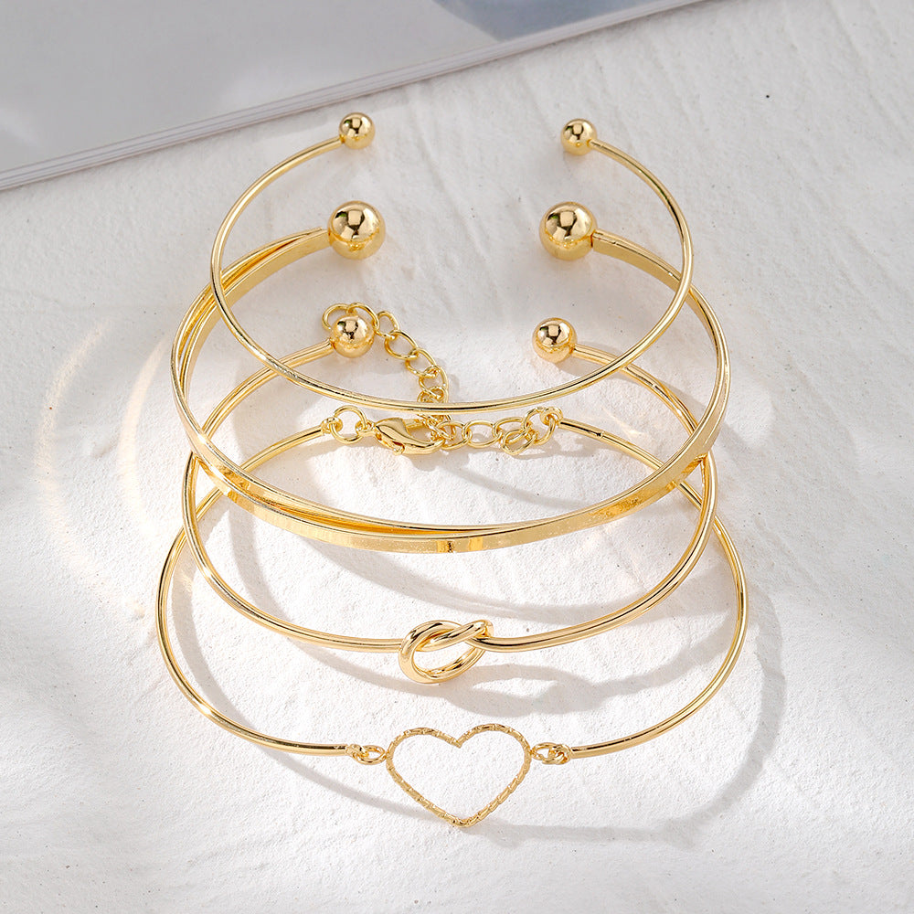 4-Piece Creative Heart Crossed Alloy Bangle Bracelet Set Secondary image